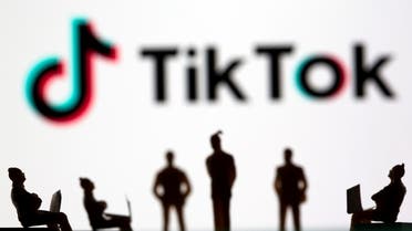 Small toy figures are seen in front of TikTok logo in this illustration picture taken March 15, 2021. (File photo: Reuters)