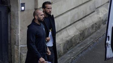 Andrew Tate and his brother Tristan are escorted by police officers outside the headquarters of the Bucharest Court of Appeal, in Bucharest, Romania, January 10, 2023. (Reuters)