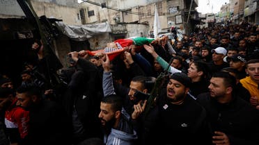 SENSITIVE MATERIAL. THIS IMAGE MAY OFFEND OR DISTURB Mourners carry the body of a 16-year-old Palestinian, who according to medics was killed during a clash with Israeli forces, at his funeral in Nablus, in the Israeli-occupied West Bank January 5, 2023. REUTERS/Mohammed Torokman