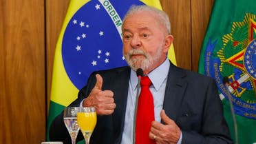 Brazilian President Luiz Inacio Lula da Silva gestures during a breakfast with accredited journalists at the Planalto Palace in Brasilia on January 12, 2023. (AFP)