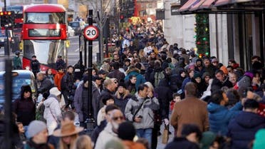 People walk along a busy shopping street, during the traditional Boxing Day sales in London, Britain, December 26, 2022. REUTERS/