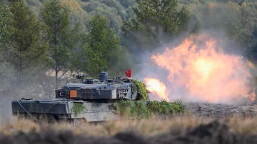 A Leopard 2 tank fires during army training at a military base of the German army Bundeswehr in Bergen, Germany, October 17, 2022. REUTERS/Fabian Bimmer