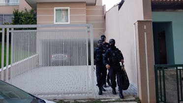 Police officers walk outside former Justice Minister Anderson Torres' house after the Brazil's Supreme Court orders his arrest following anti-democratic riots, in Brasilia, Brazil, January 10, 2023. REUTERS/Amanda Perobelli