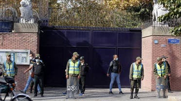 Iranian security forces stand guard outside the British embassy in Iran’s capital Tehran on October 27, 2022 as pro-regime students gather for an anti-Britain demonstration. (AFP)