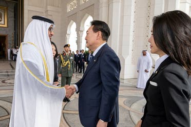 Sheikh Mohamed bin Zayed Al Nahyan, President of the United Arab Emirates, receives Yoon Suk Yeol, President of South Korea and Kim Keon-hee, First Lady of South Korea, upon their arrival for a state visit reception, at Qasr Al Watan, Abu Dhabi, United Arab Emirates, January 15, 2023. (Reuters)