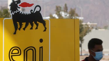 A man wearing a face mask, amid the coronavirus disease (COVID-19) pandemic, walks near the sign of Italian energy Eni company at a gas station of Egyptian International Gas Technology Gastec in the Red Sea resort of Sharm el-Sheikh, south of Cairo, Egypt February 6, 2021. (Reuters)