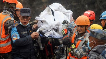 A rescue team recovers the body of a victim from the site of the plane crash of a Yeti Airlines operated aircraft on January 15, 2023, in Pokhara, Nepal January 16, 2023. (Reuters)