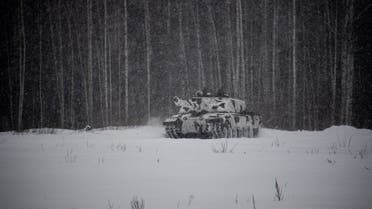 A british Challenger tank is engaged in a major drill as part of NATO's enhanced forward presence (EFP) deployment in Poland and the Baltic nations of Estonia, Latvia and Lithuania, at the Tapa estonian army camp near Rakvere on February 5, 2022. (AFP)