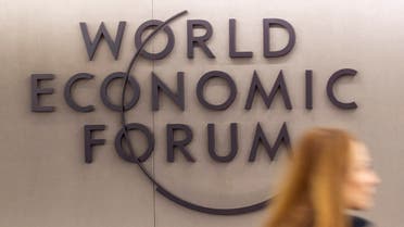 A woman walks past the logo of the World Economic Forum (WEF) 2023 at Davos Congress Centre in the Alpine resort of Davos, Switzerland, January 15, 2023. (Reuters)