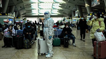 A passenger wearing protective gear is seen at a train station in Beijing on December 28, 2022. (AFP)