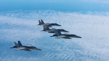 Japan's Self-Defense Force's F-15 fighter jets (top and 2nd from top) conduct an air exercise with U.S. Navy F/A 18 Hornet aircrafts in the skies above the Sea of Japan, Japan, in this photo released by the Air Staff Office of the Defense Ministry of Japan November 13, 2017. (File photo: Reuters)