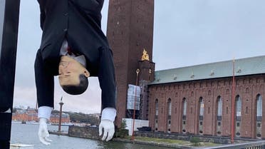 A puppet of Turkish President Tayyip Erdogan is hung by its feet during a demonstration in Stockholm, Sweden, January 12, 2023, in this image obtained from social media. (Reuters)