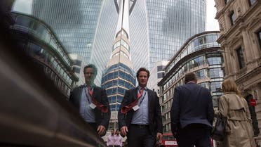 City workers walk through London, Britain September 23, 2015. London has regained its crown as the world's leading financial centre, according to a survey of industry professionals. London, which had top billing for seven years running in the twice-yearly survey, lost the top spot to New York last year. REUTERS/Neil Hall