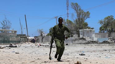 A Somali soldier runs to hold position as al-Shabaab militia storms a government building in Mogadishu, Somalia March 23, 2019. REUTERS/Feisal Omar