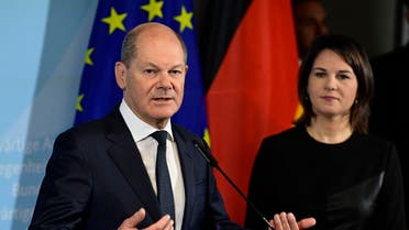 German Chancellor Olaf Scholz and German Foreign Minister Annalena Baerbock give a joint press conference after visiting a Federal Office for Foreign Affairs handling visa requests, on January 17, 2023 in Brandenburg an der Havel, eastern Germany. (AFP)
