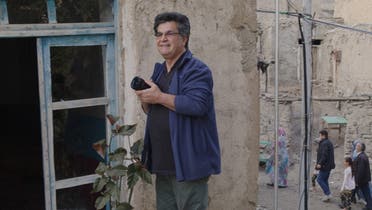 A photo of Iranian renowned dissident director Jafar Panahi during filming. (Twitter/@MovingImageNYC)