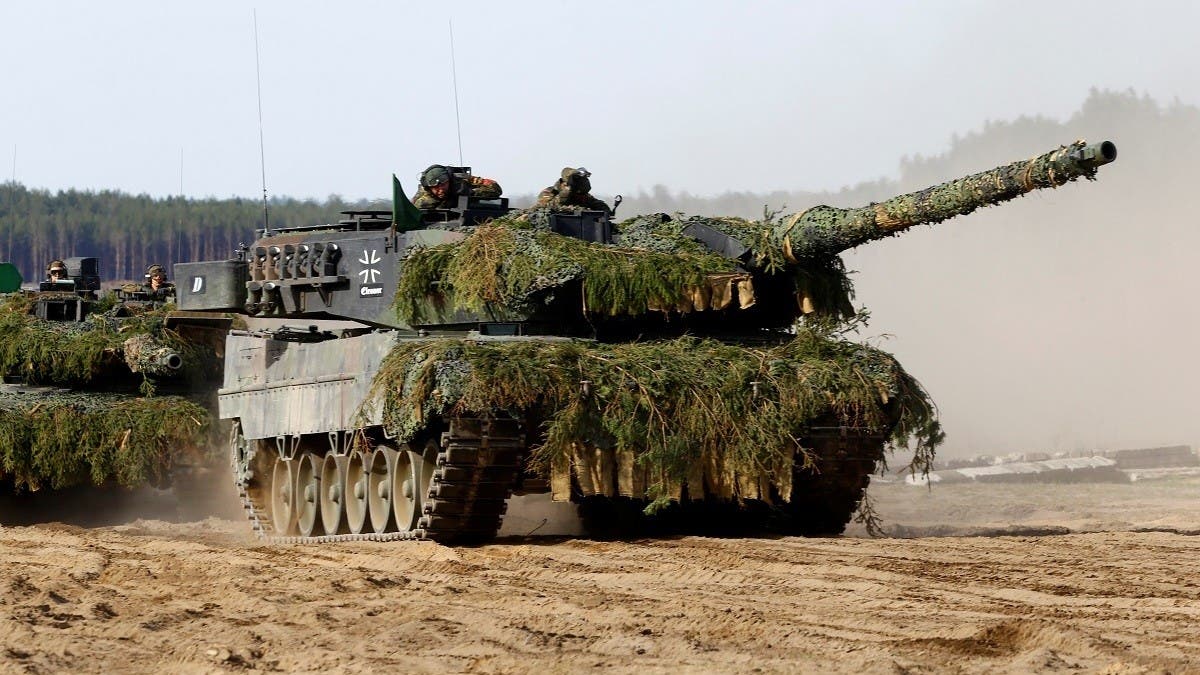 North Korea's Kim 'drives' new tank during mock battle