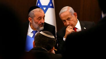 Israeli Prime Minister Benjamin Netanyahu speaks with Interior and Health Minister Aryeh Deri at a weekly cabinet meeting at the Prime Minister’s office in Jerusalem, January 8, 2023. (Reuters)
