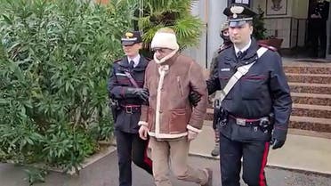 This handout video grab taken and released by the Italian Carabinieri Press Office on January 16, 2023 shows the arrest by Carabinieri of the Italy’s top wanted mafia boss, Matteo Messina Denaro in Palermo, in his native Sicily after 30 years on the run. (Handout/Italian Carabinieri Press Office/AFP)