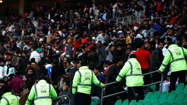 Stadium security teams monitor the seating of footbal fans ahead of the evening's final match of the Arabian Gulf Cup between Iraq and Oman at the Basra International Stadium in Iraq's eponymous southern city on January 19, 2023. (AFP)