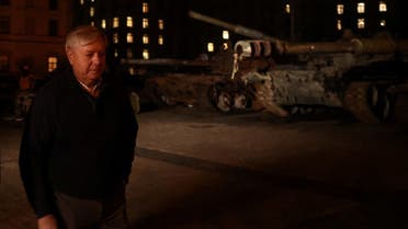 Senator Lindsey Graham walks next to destroyed Russian tanks at an exhibition in central Kyiv, Jan. 20, 2023. (Reuters)