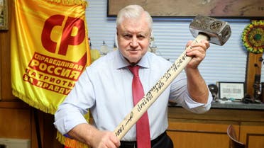 Sergei Mironov, head of the A Just Russia - Patriots - For Truth party, poses for a picture with a sledgehammer given to him by the Wagner mercenary group, in an unknown location, in this image released January 20, 2023. (Reuters)