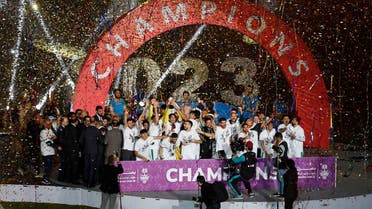 Iraq players celebrate with the trophy after winning the Arabian Gulf Cup25 Final. (Reuters)