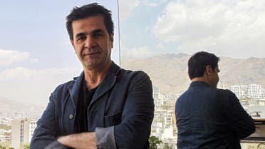 Celebrated Iranian film director Jafar Panahi stands on a balcony overlooking Tehran during an interview with AFP on August 30, 2010. (AFP)