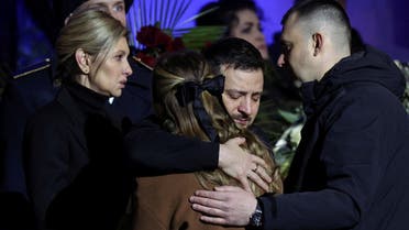 Ukraine’s President Volodymyr Zelenskyy and first lady Olena Zelenska offer their condolences as they attend a memorial ceremony for Ukrainian Interior Minister Denys Monastyrskyi, his deputy and officials who died in the helicopter crash near Kyiv, in Kyiv, Ukraine, on January 21, 2023. (Reuters)