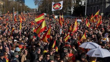 Protesters wave Spanish national flags as they gather during an anti-government demonstration called by right-wing groups, on the Plaza de Cibeles square in Madrid, on January 21, 2023. (AFP)