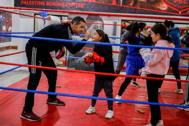 Palestinians girls warm up during training inside the first women boxing center in Gaza City. (Reuters)