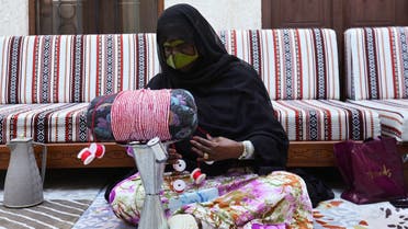 Emirati craftswoman makes Talli embroidery at the Turath Centre for Traditional Handicrafts, the educational arm of Al Shindagha Museum in Dubai, UAE. (Reuters)