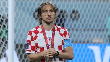 Croatia’s midfielder #10 Luka Modric celebrates with his medal after winning the Qatar 2022 World Cup third place play-off football match between Croatia and Morocco at Khalifa International Stadium in Doha on December 17, 2022. (AFP)