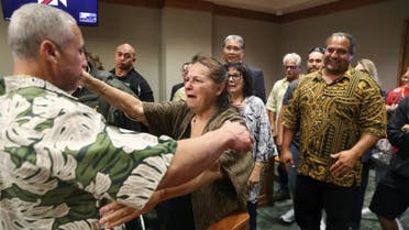 Albert “Ian” Schweitzer, left, hugs his mother, Linda, moments after a judge ordered him released from prison, in Hilo, Hawaii, on January 24, 2023. (AP)