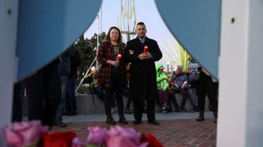 People gather for a candlelight vigil after a mass shooting during Chinese Lunar New Year celebrations in Monterey Park, California, U.S. January 24, 2023. REUTERS/David Swanson
