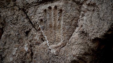 The hand imprint was carved into the stone wall of an ancient moat outside Jerusalem’s Old City. (Photo by Yuli Schwartz,@AntiquitiesIL/Twitter)