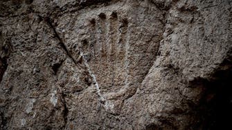 Ancient Jerusalem hand imprint baffles Israel archaeologists 