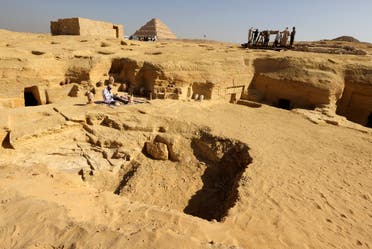 An Egyptian archaeologist restores antiquities after the announcement of new discoveries in Gisr el-Mudir in Saqqara, in Giza, Egypt, on January 26, 2023. (Reuters)
