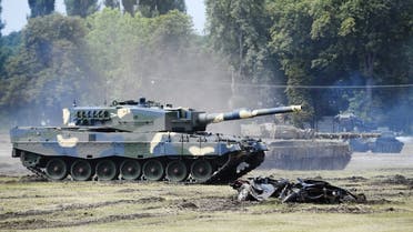 A Leopard 2/A4 battle tank rolls during a handover ceremony of tanks at the army base of Tata, Hungary, on July 24, 2020. (AFP)