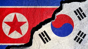 Concept North Korea and South Korea flag on cracked background. (Stock photo)