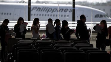 Filipina workers returning home from Kuwait arrive at Manila International Airport on February 18, 2018. (AFP)