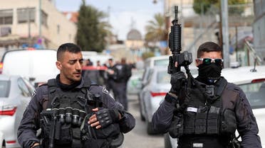 Israeli security forces gather in Jerusalem’s predominantly Arab neighborhood of Silwan, where an assailant reportedly shot and wounded two people, on January 28, 2023. (AFP)
