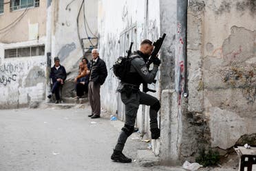 An Israeli Border police officer walks up to the house of Palestinian gunman Khaire Alkam in A-Tur in East Jerusalem, after Alkam shot dead at least seven people near a synagogue in Neve Yaacov which lies on occupied land that Israel annexed to Jerusalem after the 1967 Middle East war, January 28, 2023. (File photo: Reuters)