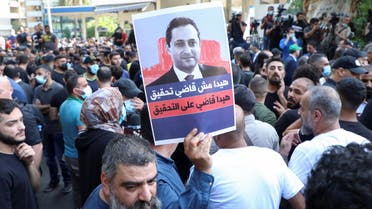 Supporters of Lebanese Shi'ite groups Hezbollah and Amal and the Christian Marada movement take part in a protest against Tarek Bitar, the lead judge of the port blast investigation, near the Justice Palace in Beirut, Lebanon October 14, 2021. (File photo: Reuters)