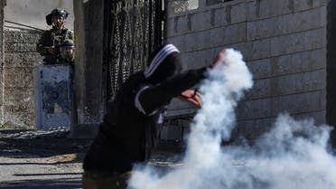 Palestinian demonstrators clash with Israeli troops following a protest against the expropriation of Palestinian land by Israel in the occupied- West Bank, in the village of Kfar Qaddum, near the Jewish settlement of Kedumim, on January 20, 2023. (Photo by jaafar ashtiyeh / AFP)