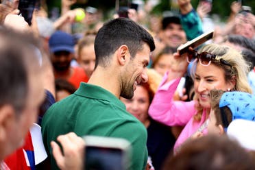 Australian Open champion Serbia’s Novak Djokovic with fans outside Government House, Melbourne, Australia, on January 30, 2023. (Reuters)