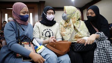 Mothers of acute kidney injury (AKI) victims attend a preliminary hearing for a class-action lawsuit filed against the Indonesian government and drug companies for allowing the sale of tainted cough syrup at the court in Jakarta, Indonesia, on January 17, 2023. (Reuters)