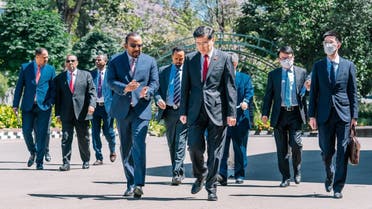 This handout image taken and distributed on January 10, 2023 by the Ethiopian Prime Minister’s Office in Addis Ababa shows Chinese Foreign Minister Qin Gang (C-R) walking with Ethiopian Prime Minister Abiy Ahmed (C-L) during their bilateral meeting at the Prime Minister’s office. (Ethiopia Prime Minister Office/AFP)