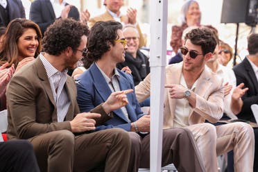 The Jonas Brothers and Priyanka Chopra react during their star unveiling ceremony on The Hollywood Walk of Fame in Los Angeles, California, US, January 30, 2023. (Reuters)