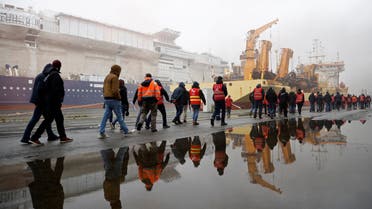 French energy workers on strike gather with dockers to protest against French government's pension reform plan, in the port of Saint-Nazaire, France, January 26, 2023. (Reuters)